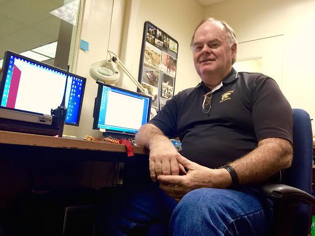 Microcomputer specialist Ed Shadoin sits  in his office located in the Media Center, his headquarters for  maintaining the schools computers. 