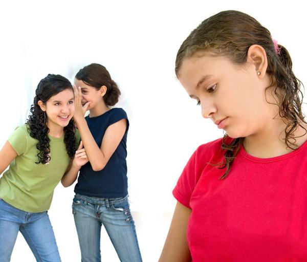 "two young girls laughing behind another girls back"

photo + subtext courtesy of Wikimedia Commons