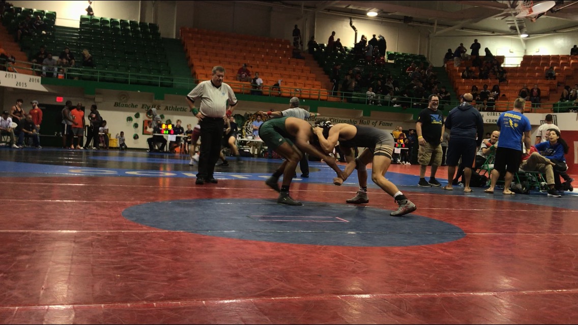 Junior Daniel Ellison (right) wrestles Flanagan opponent (left) at the BCAA championship tournament on Jan. 26.