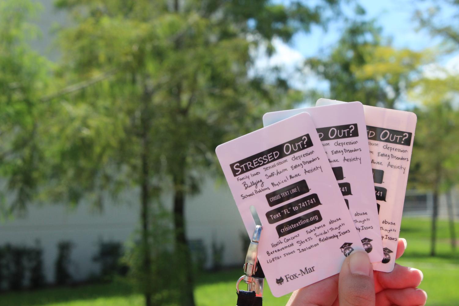 New students IDs include a crisis hotline number for easy access.