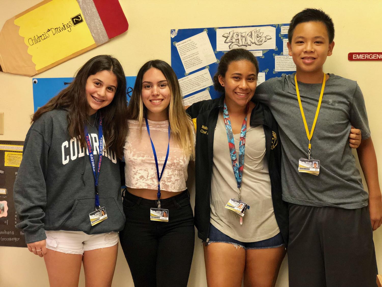 Students Lauren Schwartz, Sophia Vasquez, Marisa Moo Young and Nathan Nguyen display their daily worn IDs.