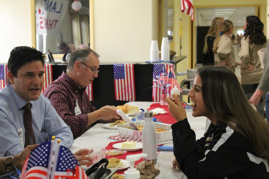 Junior+Genevieve+Perez+and+veteran+Anthony++Leventhal+enjoy+the+Veterans+Day+lunch+on+November+9.