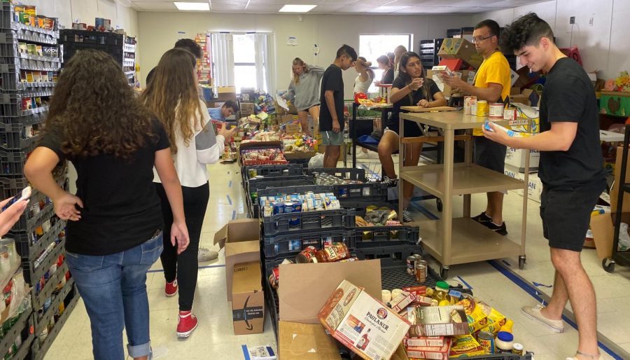 Student volunteers work in the portables in early November to organize incoming donations for the Harvest Drive. 
