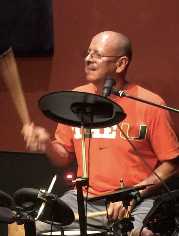 Social Studies Teacher Carlos Velasquez plays the drums in his cover band Smugglers Reef.