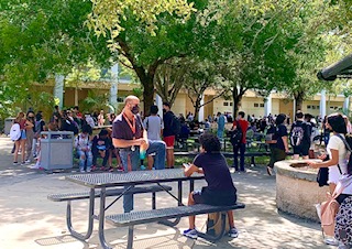 The outside lunch tables are crowded once again now that students are back in school.