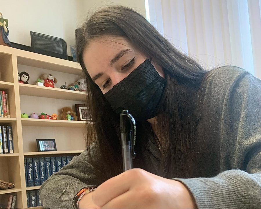 Sophomore Ella Dever works in math class on Nov. 1, the first day masks were no longer mandatory.  