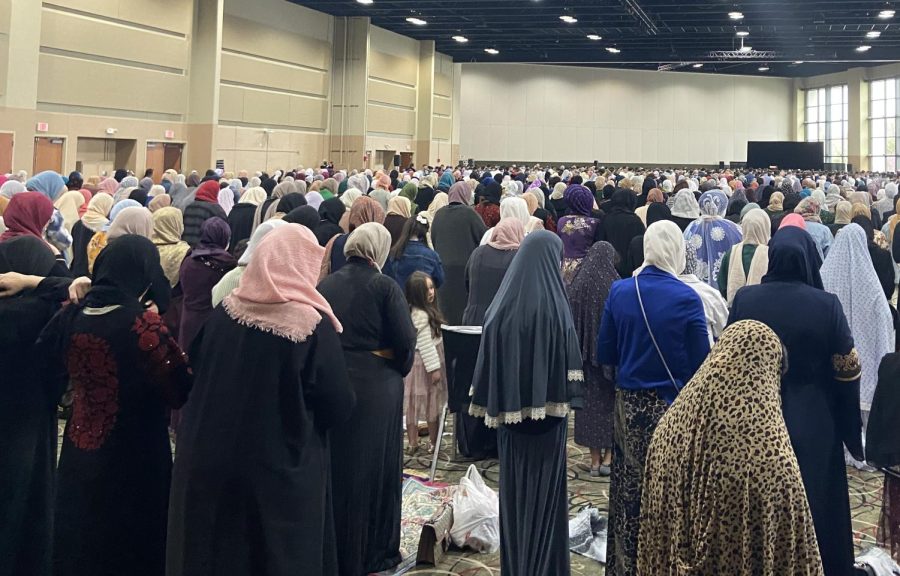 Muslims stand for the morning Eid prayer in Tinley Park, IL. 